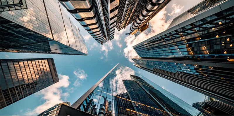 Ground-level shot of the sky in between skyscrapers